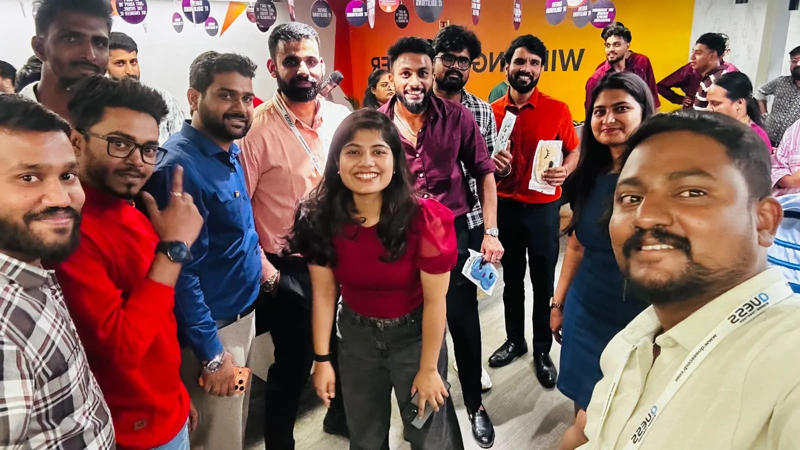 Group selfie of Quess Corp employees at the ergonomic session