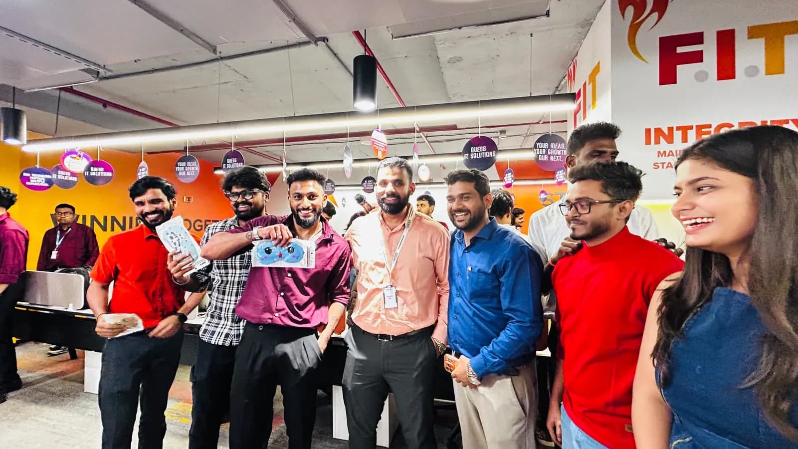 Quess Corp employees smiling together after the Physio At Your Doorstep ergonomic session